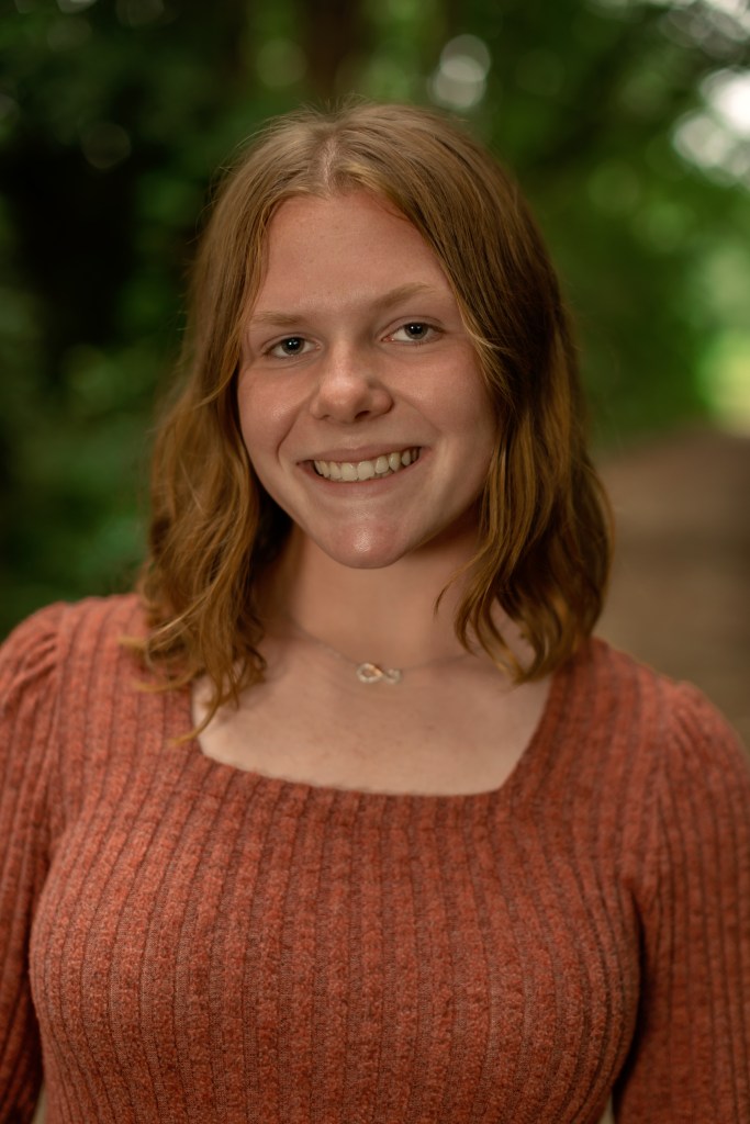 Natural light close-up senior portrait with true-to-life skin tones and soft background