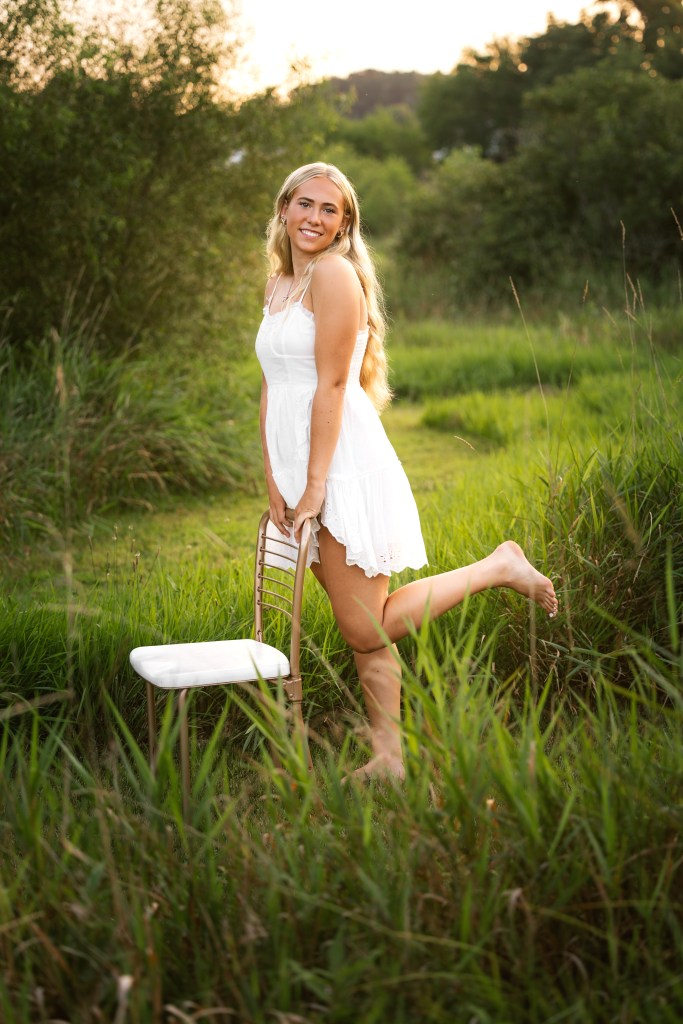 Senior posing in tall grass in Benton Harbor, MI