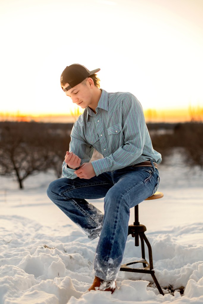 senior male in snow posing for picture southwest michigan