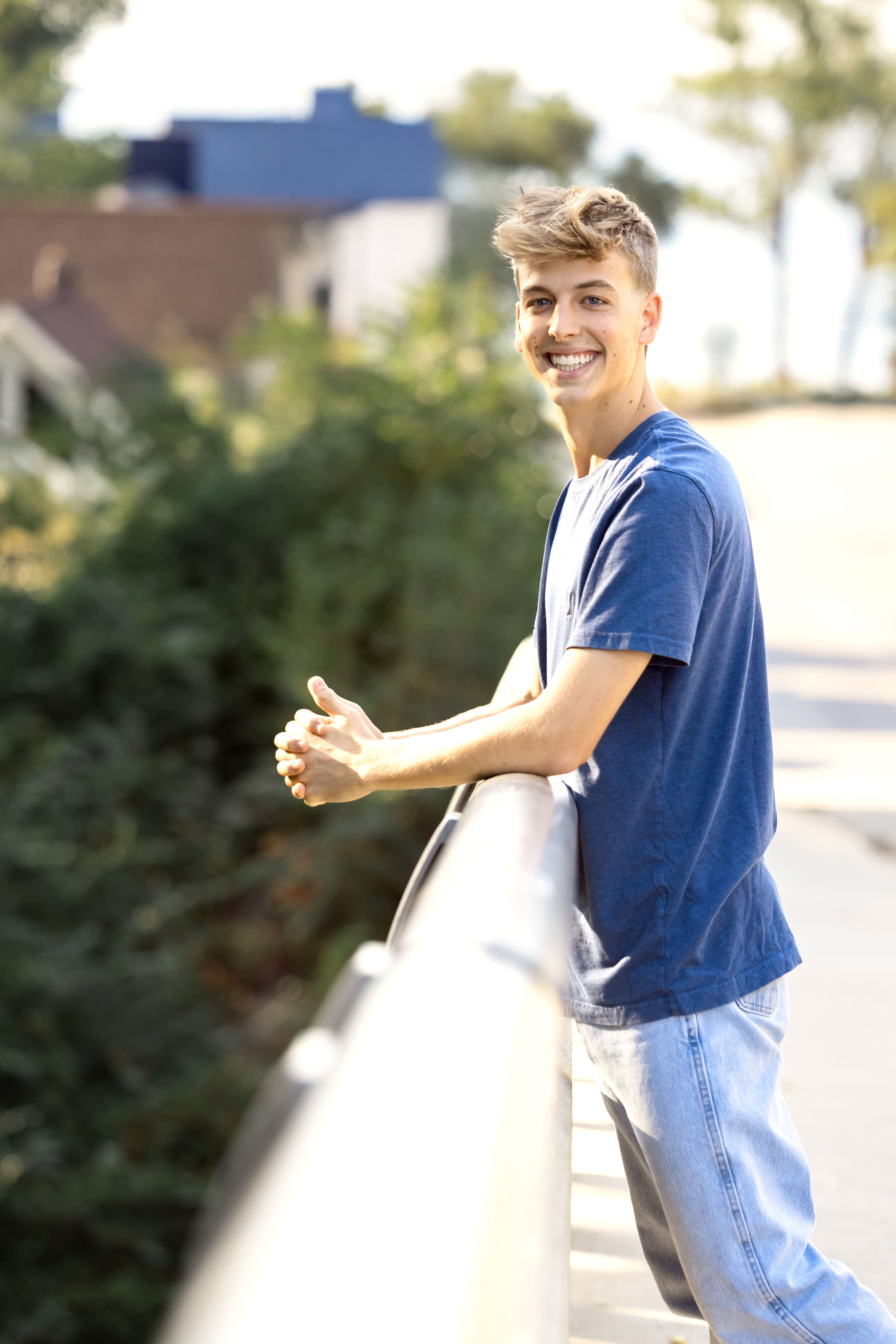 senior on bridge by lake michigan