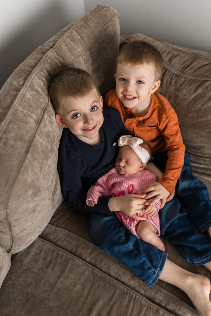 proud brothers in home family photography michigan