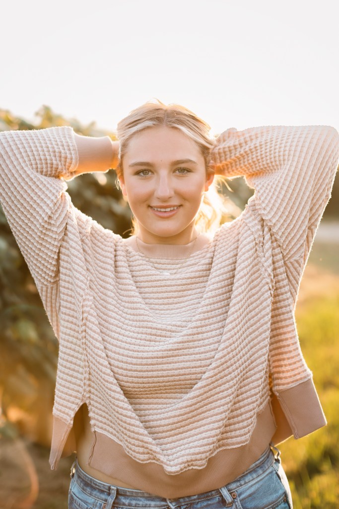 Senior in lawton michigan posing in vineyard from schoolcraft high school