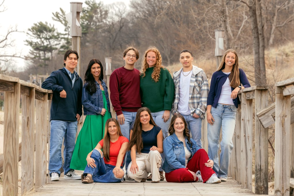 Senior rep team posed on wooden walkways and dunes at Weko Beach in Bridgman