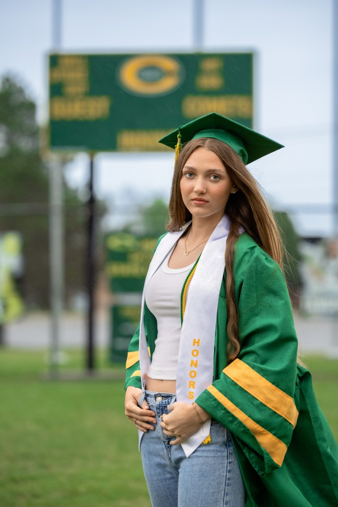 Graduating Coloma Varsity Softball player photographed on softball field in Southwest Michigan