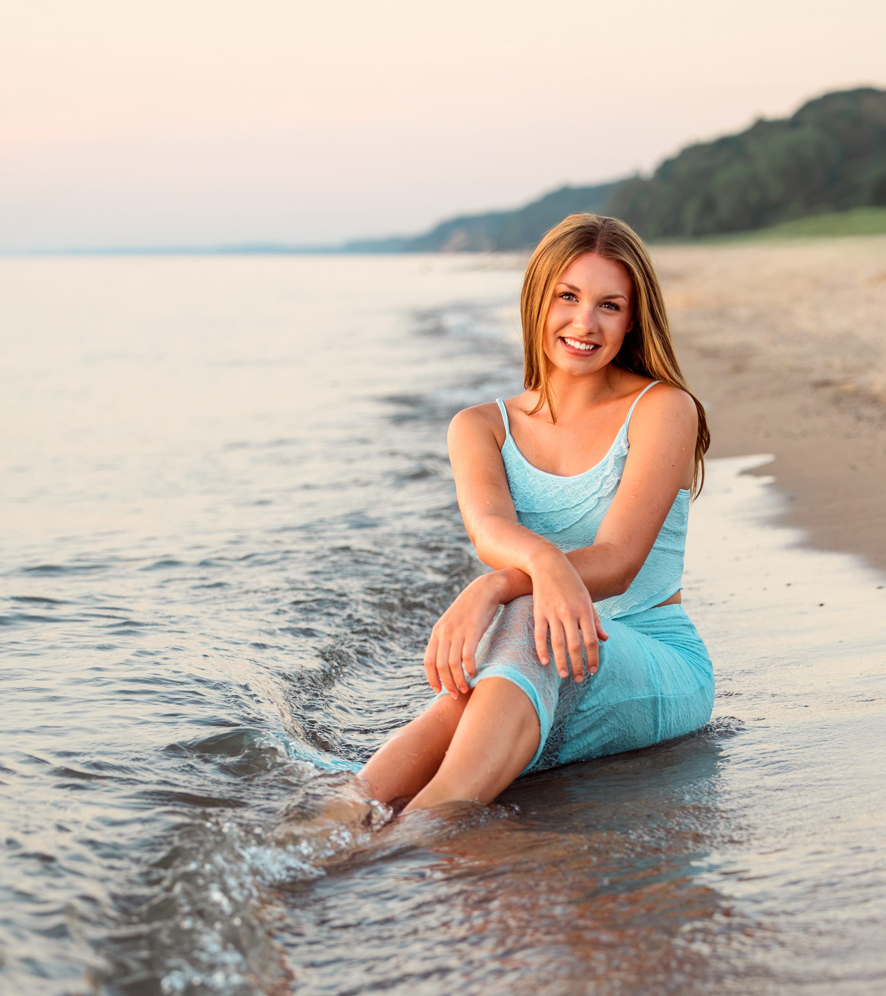 Senior portrait of Emma enjoying the Lake Michigan shoreline at Jean Klock Beach during a summer evening in Southwest Michigan.