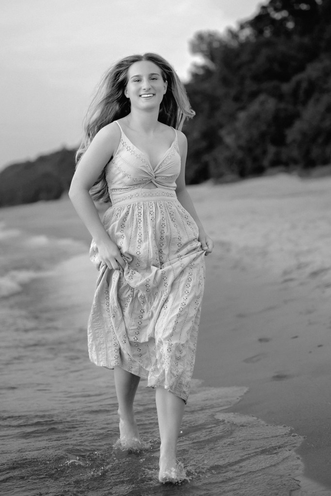 Class of 2027 senior portrait on the beach at Rocky Gap County Park.